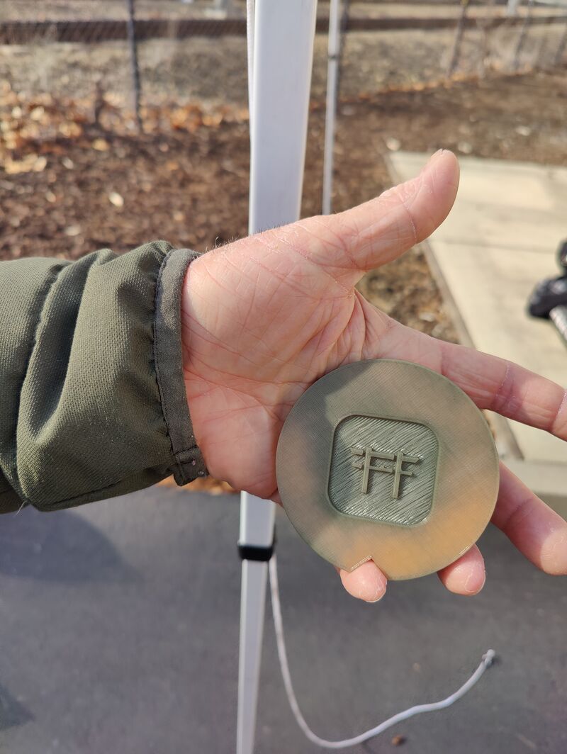 Andre 3D Print Heat Color Change Hacker Dojo Logo Puck.jpg